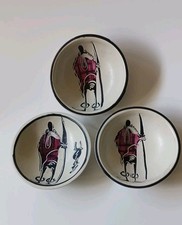 Set of three hand-carved Kenyan soapstone African bowls with a Maasai warrior