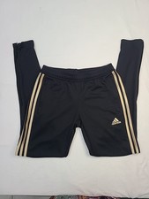 pair of black Adidas Tiro 17 training pants with gold stripes and logo. SIZE S