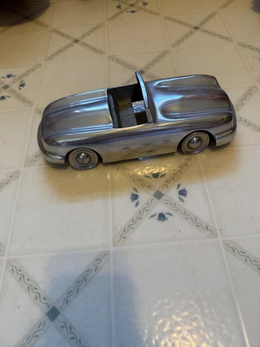 Vintage car made from aluminum about 10 inches long