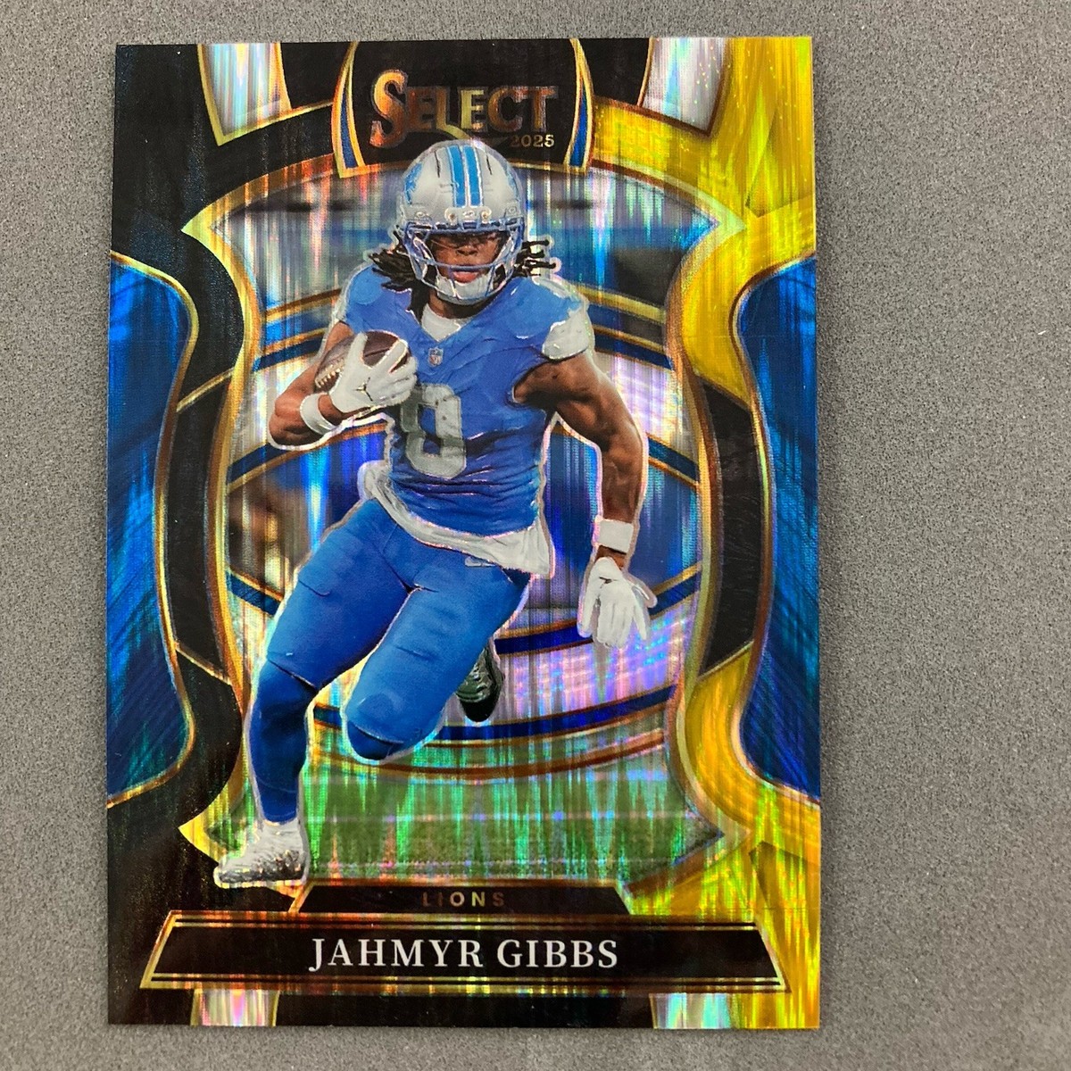 Jahmyr Gibbs 2025 Panini Select Black & Yellow Shock Prizm #71