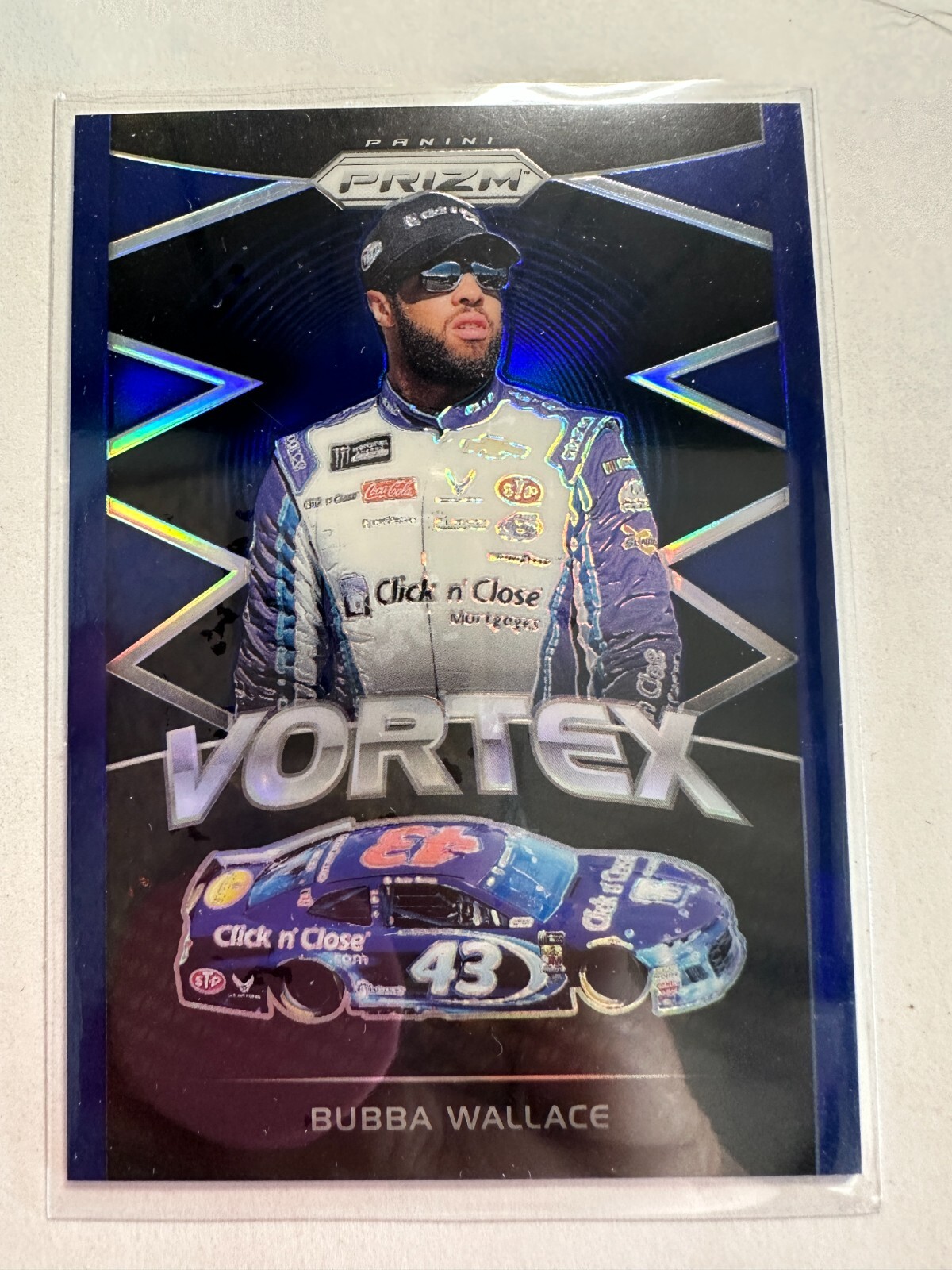 K33,465 - 2018 Panini Prizm Prizms Blue #57 Bubba Wallace VOR #/99