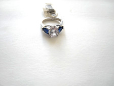 New Rhodium Ring with 1-8mm round white CZ in center  2-5x7mm Shape Sapphires