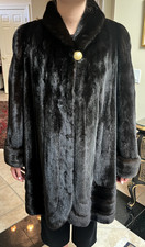 Natural ranch letout female mink, dark brown. 36" swing coat with swirl design