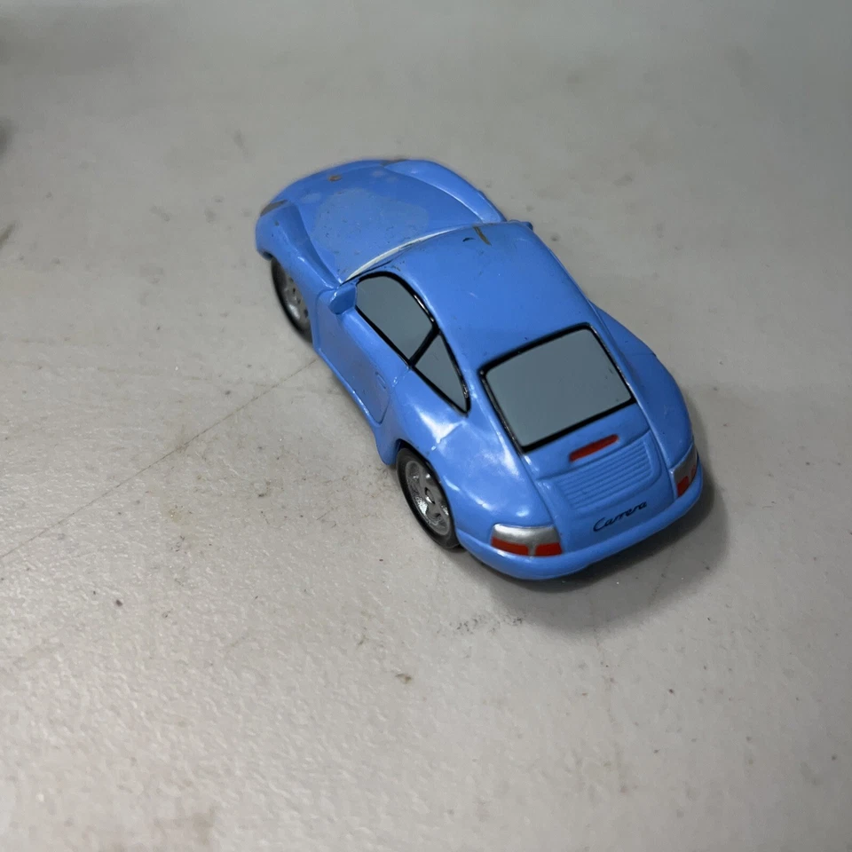 Coche de plástico Disney Pixar Cars Porsche 911 Sally escala 1:55 % Foto 4 de 4