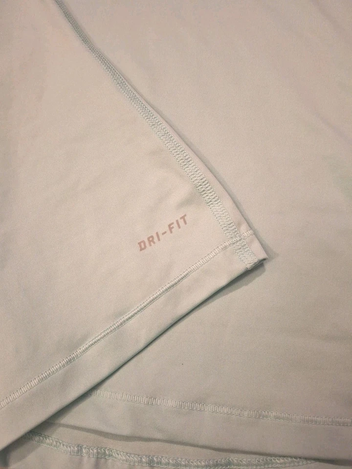 Camiseta sin mangas NIKE PRO DRI FIT azul claro y naranja con logotipo retroceso para mujer talla mediana Foto 3 de 4