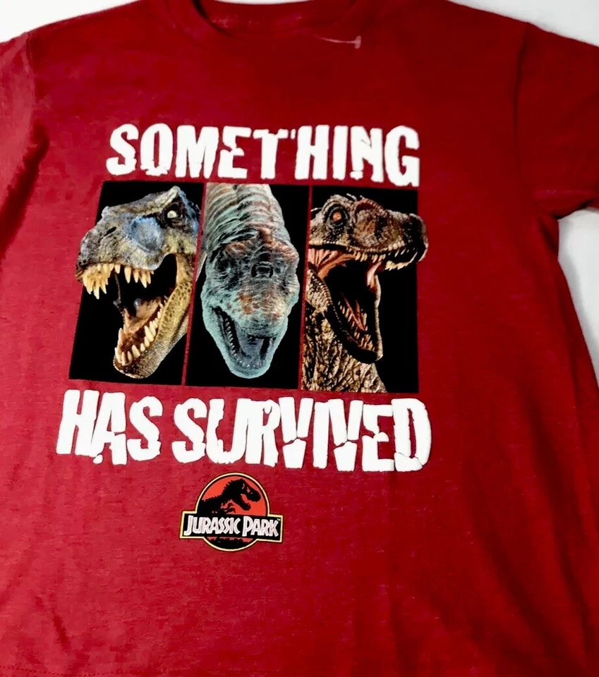 Camiseta roja Jurassic World Boys CL 14-16 Something Has Survives T-Rex Raptor S/S Foto 3 de 4