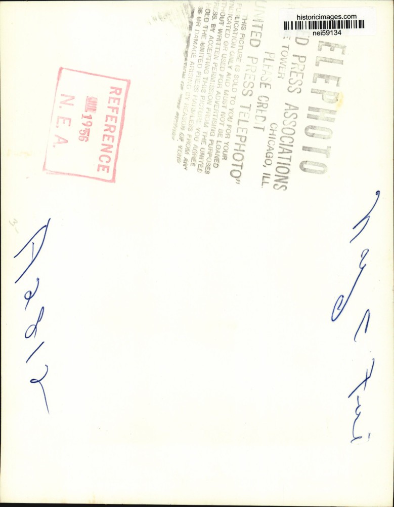 1956 Press Photo Crowd watching firemen spray water on Wanamaker store, New York