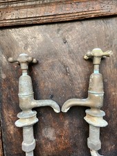 Pair of antique Victorian unpolised brass bath or sink taps