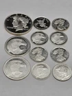 Mixed Silver Rounds 1.82 Troy Oz. total. Eight 1/10 oz Two 1/4 OZ One 1/2 oz