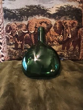 Green glass tear drop shaped decor bottle.