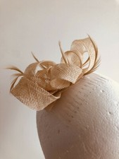 Cream loop fascinator with biot feathers on a comb. Gorgeous on 