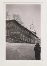Beautiful Industrial Building Snowy Winter Silhouetted Man Stands in the Corner