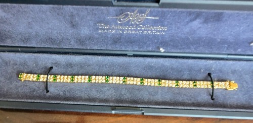 Stunning Gold Over Sterling Silver CZ and Faux Emerald Tennis Bracelet