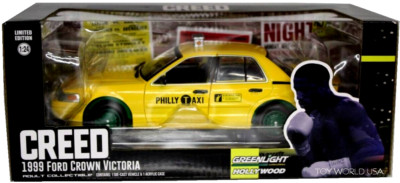 Modèle Réduit Diecast GREENLIGHT 1:24 - Ford Crown Victoria Taxi Philly 1999 (film Creed) - Neuf