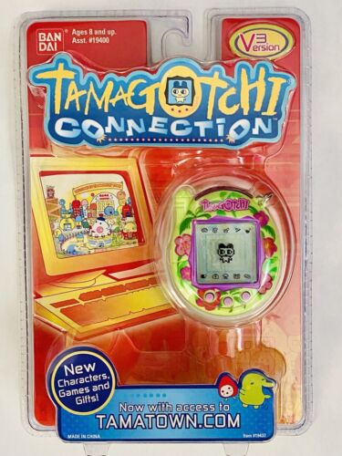 ✨ Tamagotchi Connection V3 2004 Brand New Tropical Green Flowers Hibiscus Sealed - Afbeelding 1 van 8