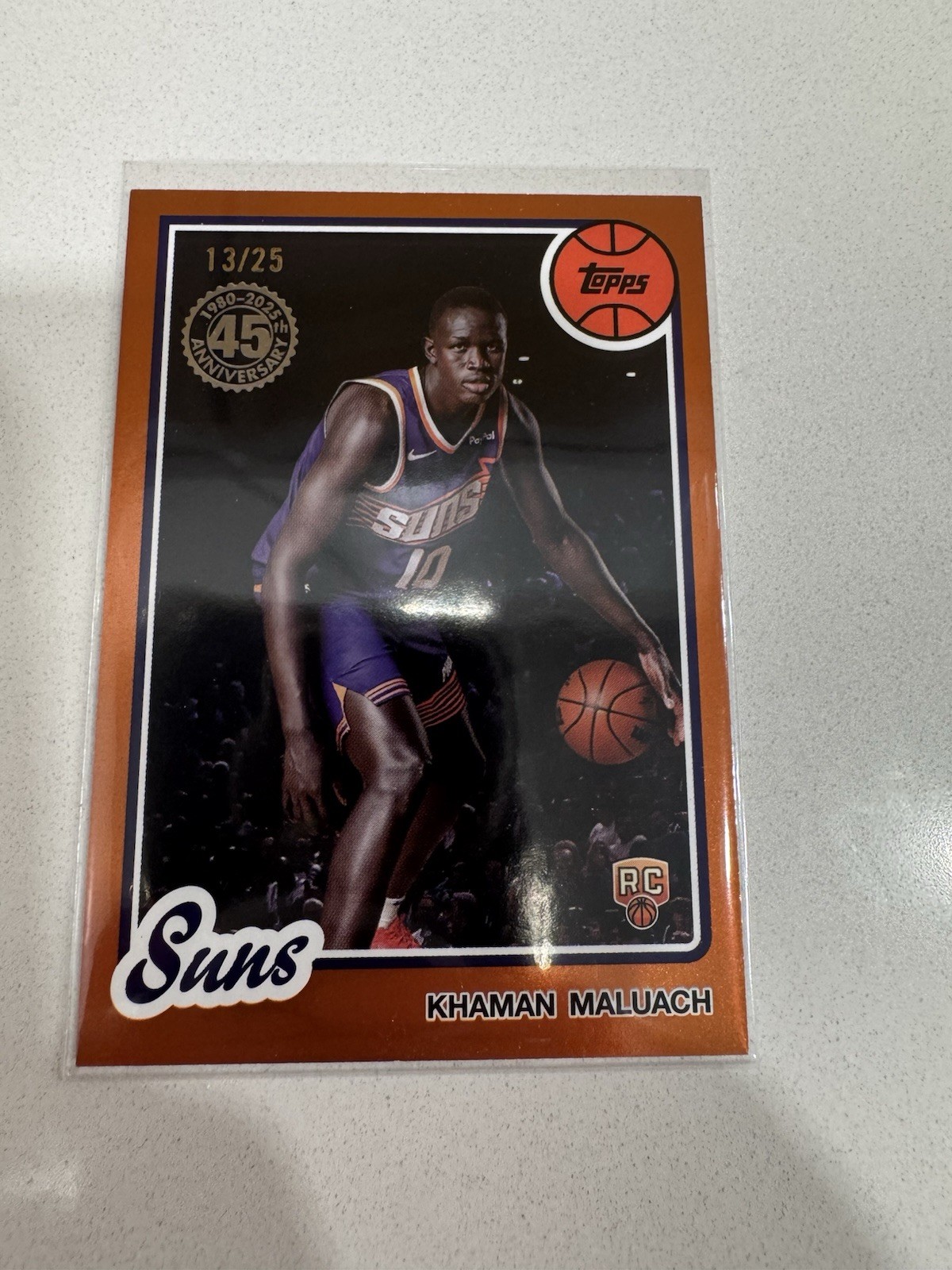 2025-26 Topps #80BK-57 / Khaman Maluach RC Suns / 1980 45th Orange Holo #/25