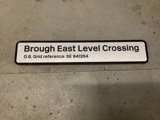 Decommissioned railway Brough East Level Crossing sign near Hull VG condition