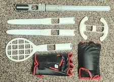 Lot of Wii Accessories Steering Wheel Tennis Racket Light Saber Boxing Gloves