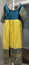 Teal and yellow colored gown with grand zari and Stones/beads.