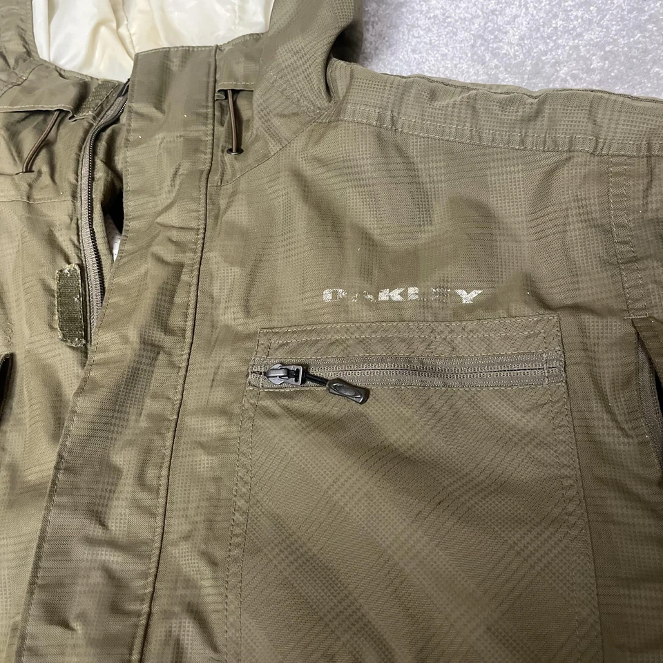 Chaqueta Oakley Para Hombres XL Verde Oliva Con Capucha Calce Suelto Snowboard Esquí Pit Bolsillos con Cremallera Foto 2 de 4