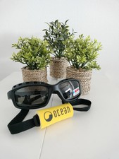 Gafas de sol negras con cinta de sujeción am...