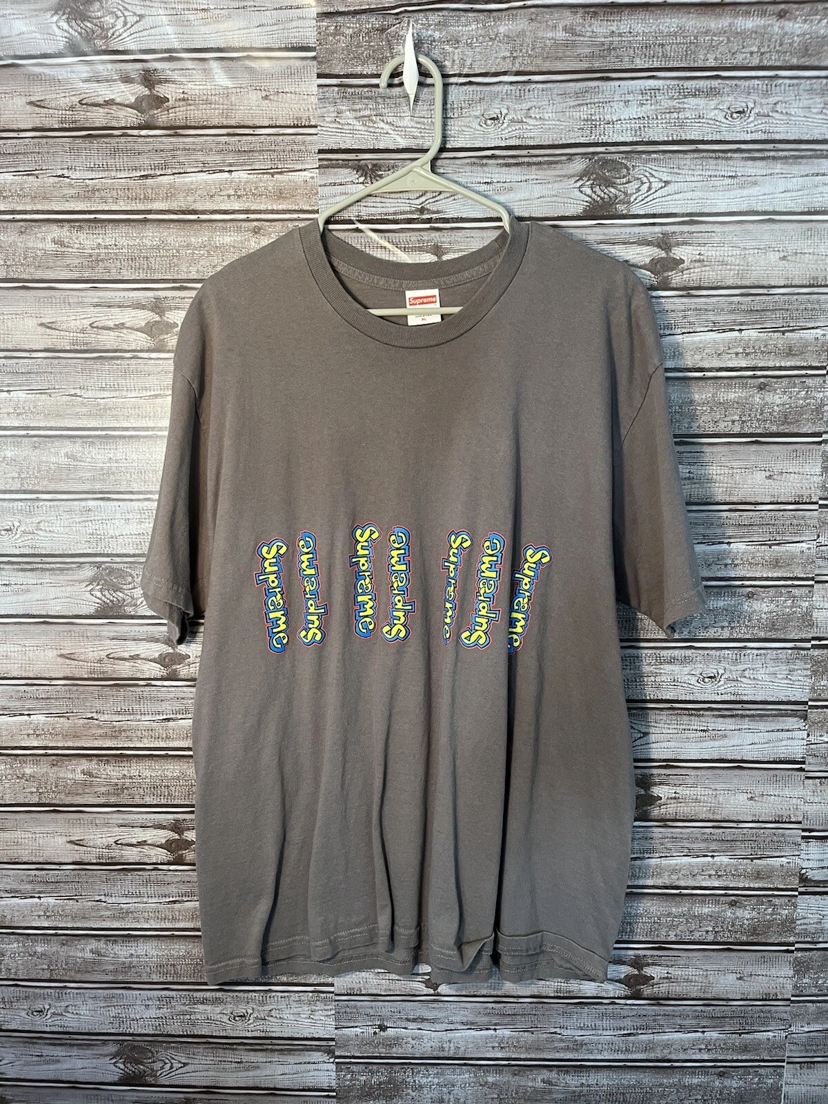 T shirt vintage logo vertical suprême skateboard noir jaune fabriqué aux États Unis taille XL