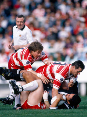 Andy Goodway and Bobbie Goulding of Wigan take down an opponent d - Old Photo