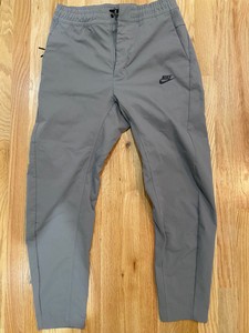 nike tech tapered pants