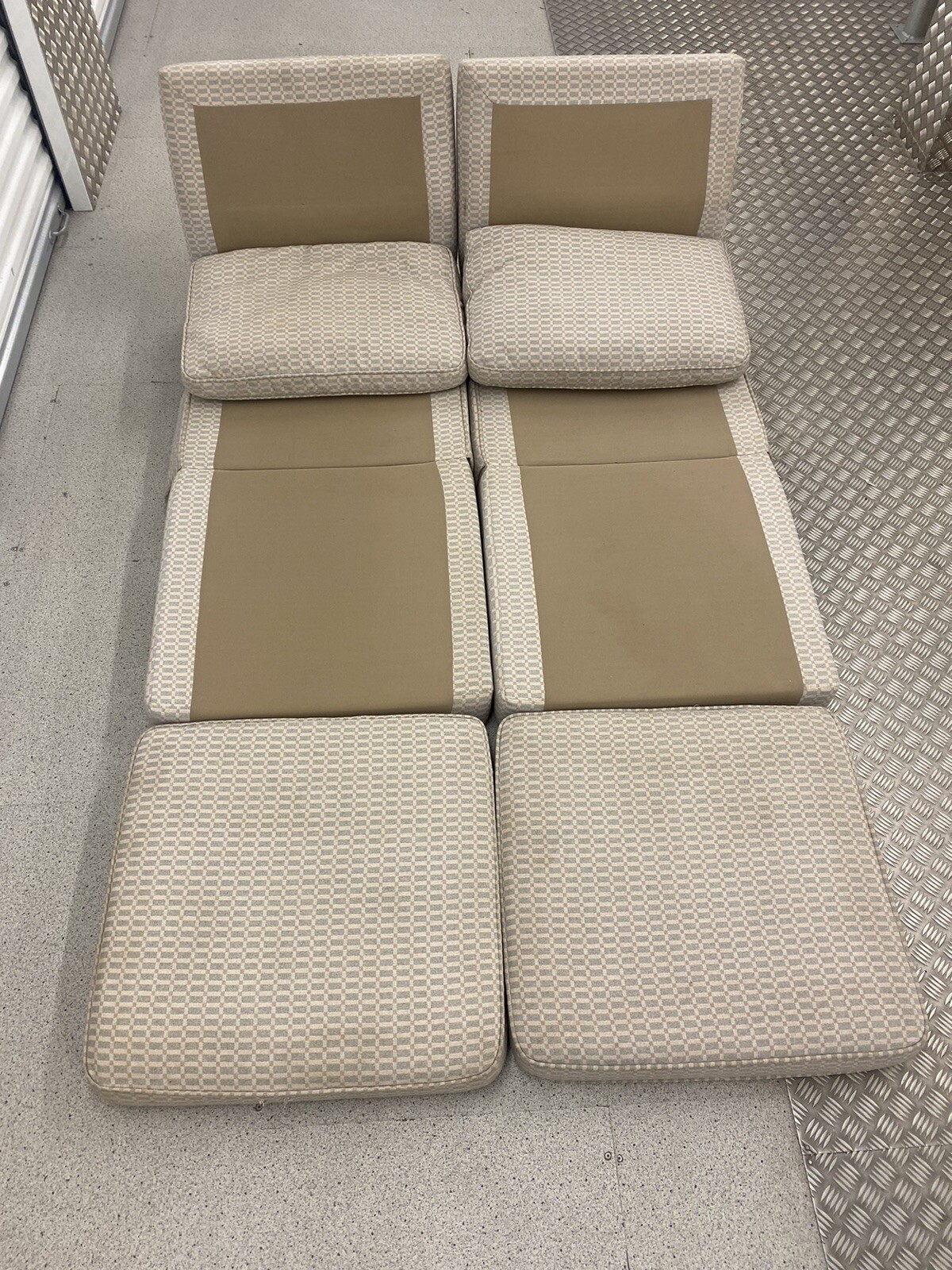 A pair of fold out chair beds, folding bed chairs, transformable double