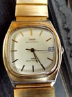 TIMEX  MENS GOLD PATINA ORIGINAL  1980'S  E-LINE DATE 34 MM FLIP  STRAP
