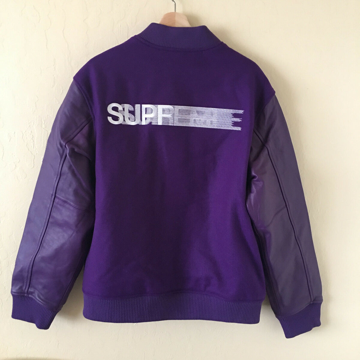 パープルは Supreme - Supreme Motion Logo Varsity Jacket Lの通販 by