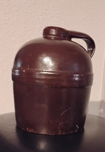 Bottom Marked Red Wing Stoneware 1/2 Gallon Jug.  Molded.  Brown Glaze.