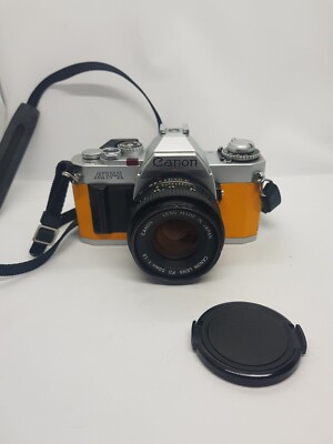 Canon AV-1 35mm Spiegelreflexkamera mit Objektiv 50 mm f/1,8   gelbes Leder