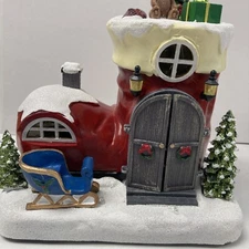 new Avon Santa in Stocking tabletop light up Musical Animated  Christmas Holiday