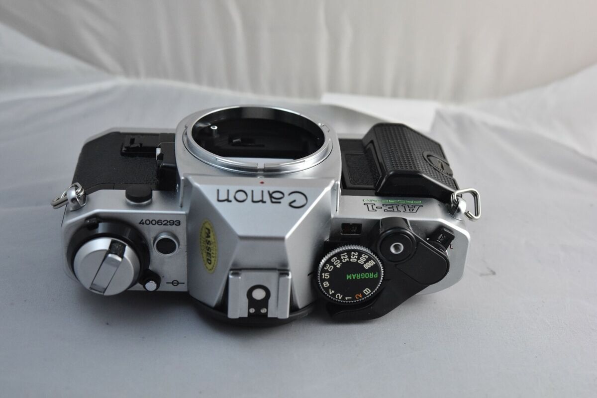 Canon AE-1 Program, mint, includes box, manual and paper Canon AE-1 Program, mint, includes box, manual and paper