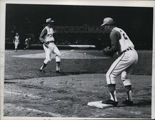 Press Photo Baseball game action as player stands at a base - net27546