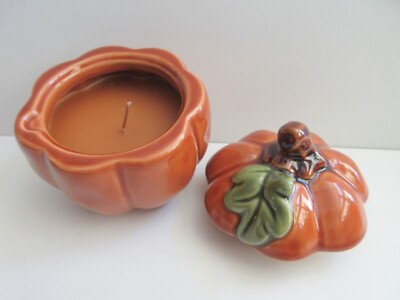 Ceramic scented pumpkin candle holder with lid.   small chip inside