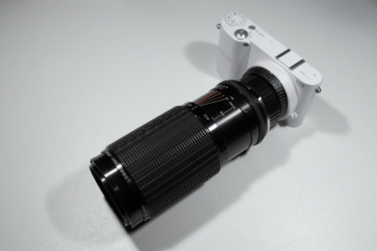 Sigma 80-200mm F3.5-4 Zoom lens Olympus OM mount + cap and lens...