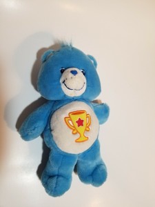 care bear with trophy on belly
