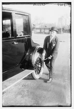 Chamlee fixing tire,automobile maintenance,smoking cigarettes,cars,vehicles,men