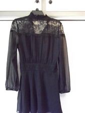 Size M Long Sleeve Little Black Dress by DV very flattering with a zipper up the