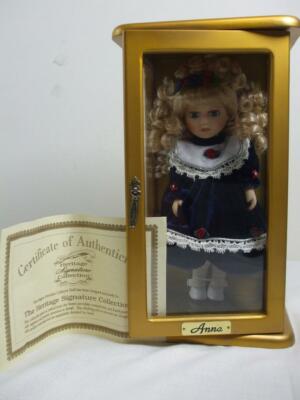 Heritage Signature Collection Blonde Anna Porcelain Doll In Wood Display Cabinet Blonde Anna Porcelain Doll, Porcelain Doll Display Cabinet