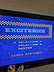 Nintendo NES Console Lot with 2 Controllers, 1 Zapper, 7 Games, and Cords