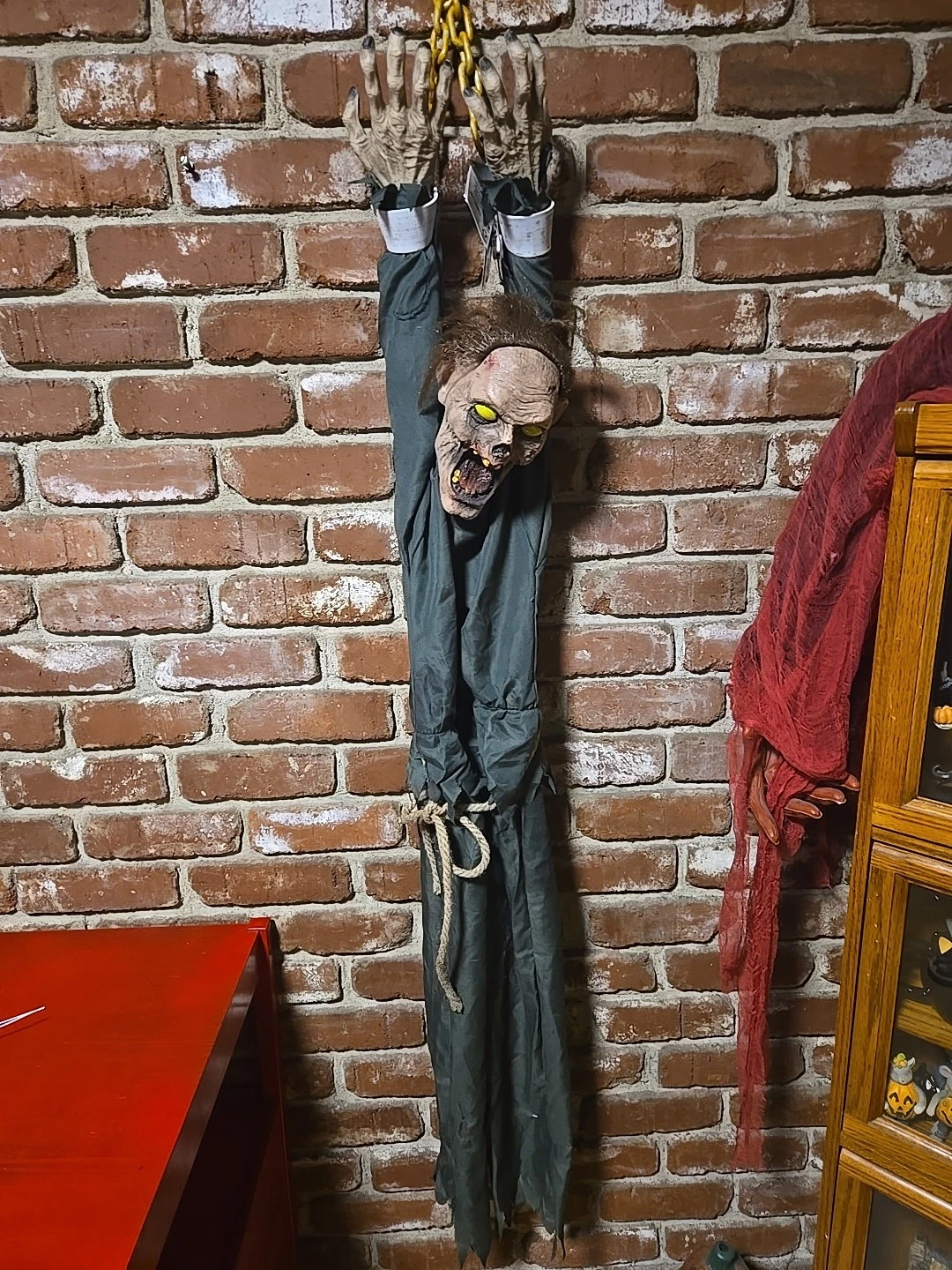 Celebrate Halloween 5' ft. Animated Light-Up Hanging Zombie In Chain Prop.