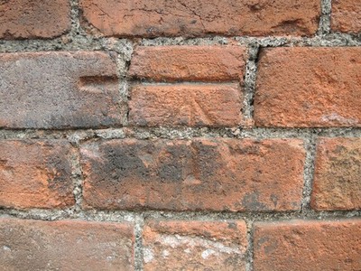 Foto A2 Benchmark on St James Place Emerson's Green A Cutmark on a bric c2021