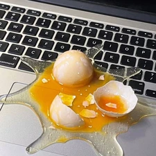 Egg Cracker Phone Stand – Funny Broken Egg & Spilled Milk Tea Prank Toy | Novelt