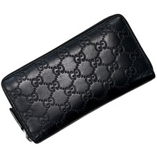Gucci GG long wallet with black zip-around closure and striped lines product