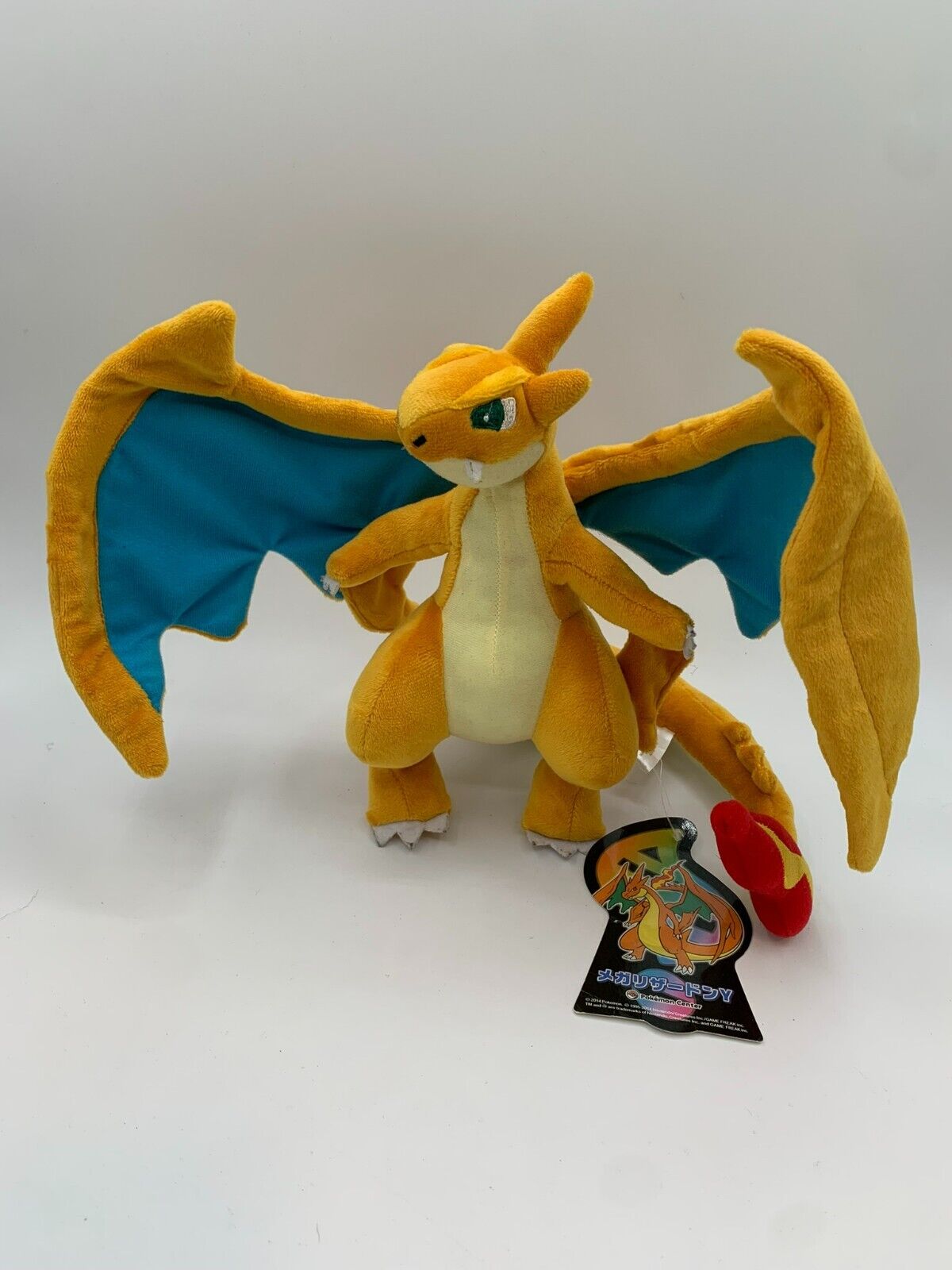 Pelúcia Mega Charizard X Pokémon Center - Toy Store - Brinquedos