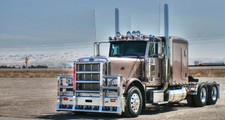 Classic chrome Peterbilt tractor photograph, snowcapped plains backdrop, heavyha