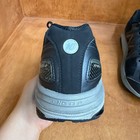 Black and gray New Balance 1540V2 men’s running shoes with silver logo, mesh uppers, and “ENC” text on heel.